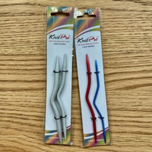Knitters Cable needles, coloured metal, pairs in packaging